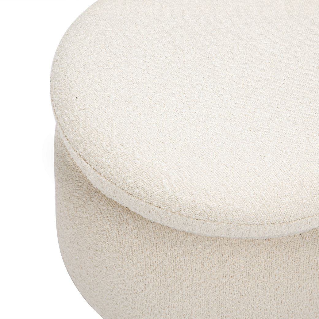 Closeup view of The Babyletto Enoki Storage Ottoman in --Color_Ivory Boucle