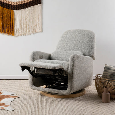 The Ubabub Arc Electronic Recliner and Swivel Glider reclined in a room in -- Color_Black White Boucle