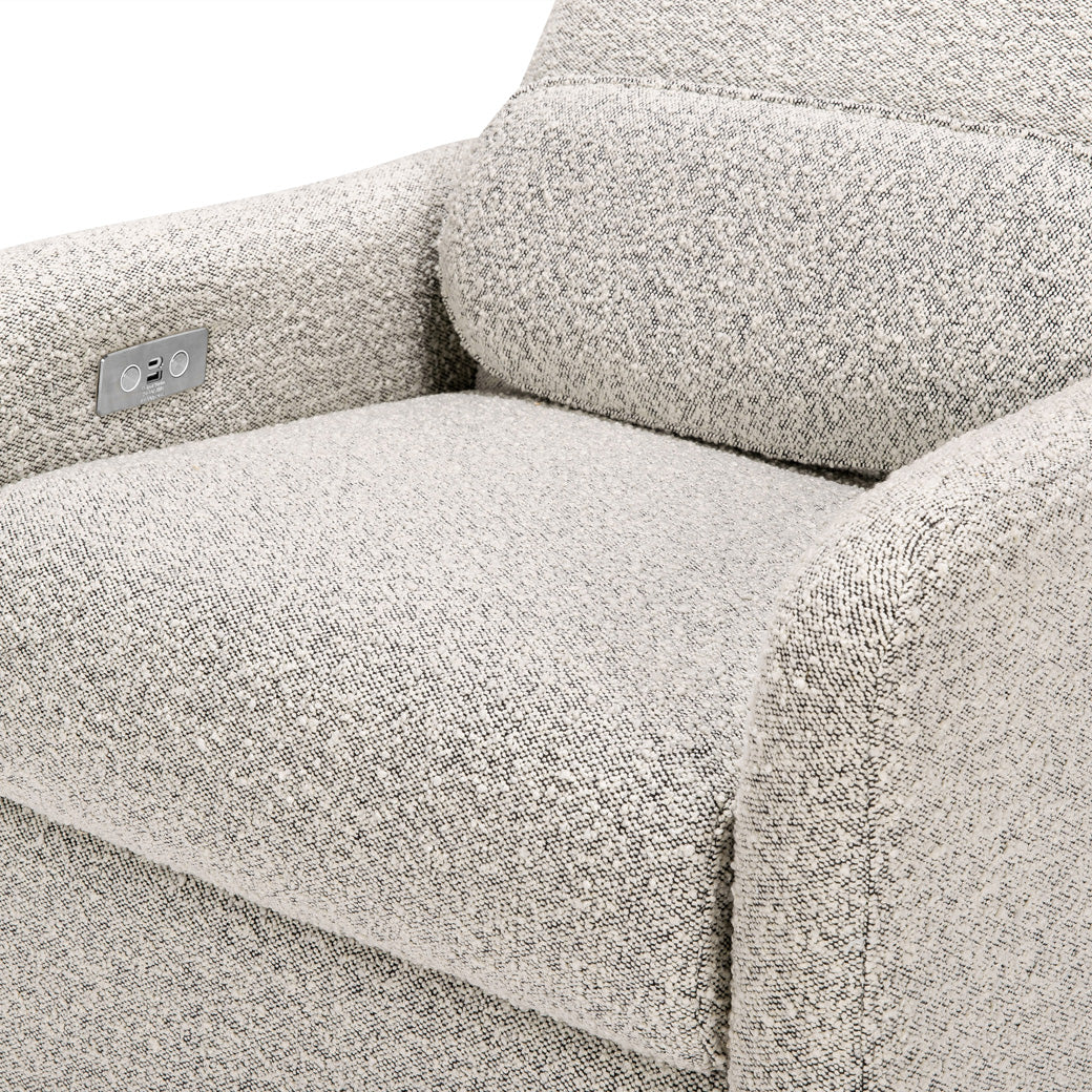Close up of the seat of the The Ubabub Arc Electronic Recliner and Swivel Glider in -- Color_Black White Boucle