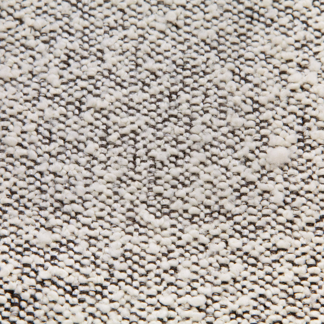 Close up of the material of the Ubabub Arc Electronic Recliner and Swivel Glider -- Color_Black White Boucle