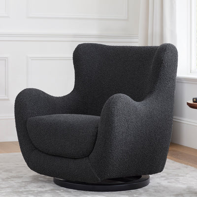Lifestyle view of Nursery Works Solstice Swivel Glider in --Color_Black Boucle with Black Wood Base