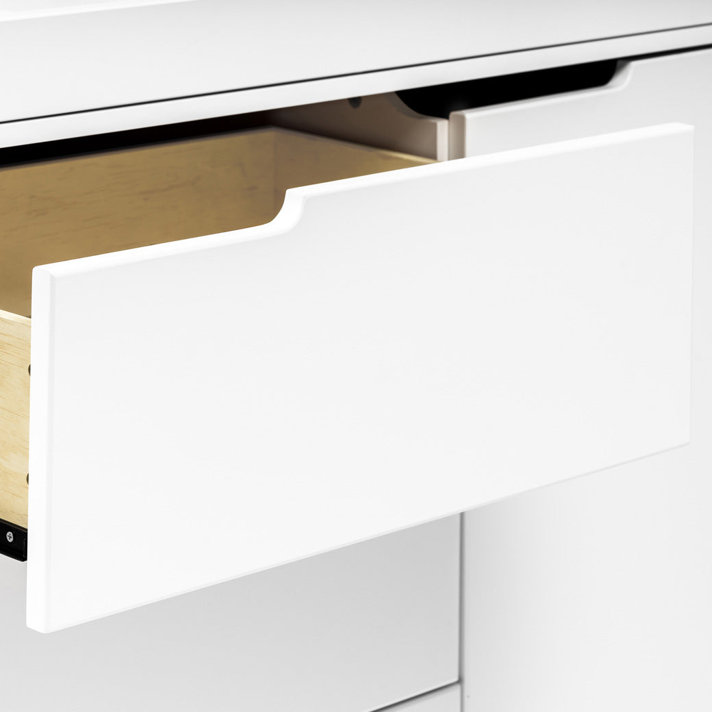 Closeup of open drawer of The Babyletto Hudson Changer Dresser in -- Color_White