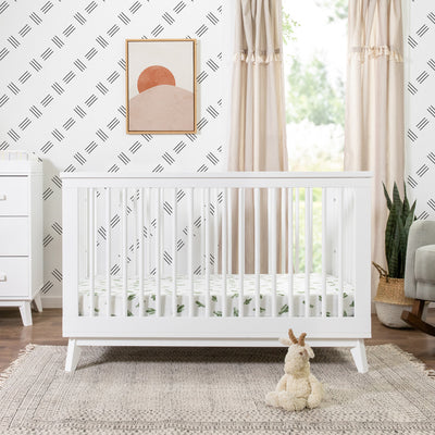 Babyletto's Scoot 3-in-1 Convertible Crib in a cozy room  in -- Color_White