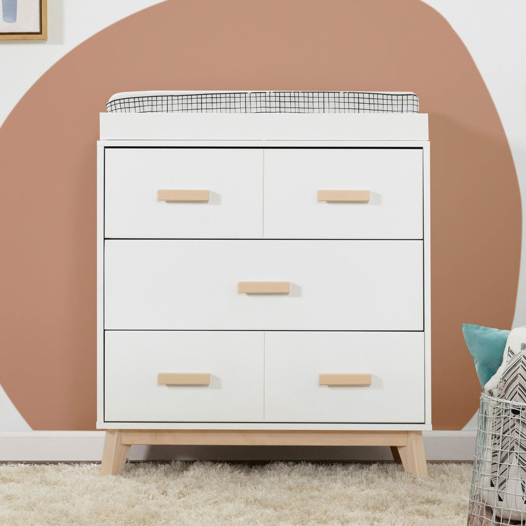 Front view of Babyletto's Scoot 3-Drawer Changer Dresser in a room  in -- Color_Washed Natural/White