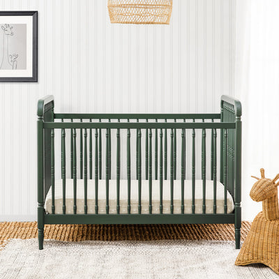 Lifestyle front view of The Namesake Liberty 3-in-1 Convertible Spindle Crib in -- Color_Forest Green