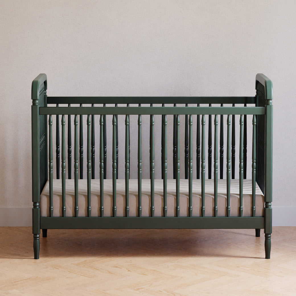 Lifestyle front view of The Namesake Liberty 3-in-1 Convertible Spindle Crib in -- Color_Forest Green