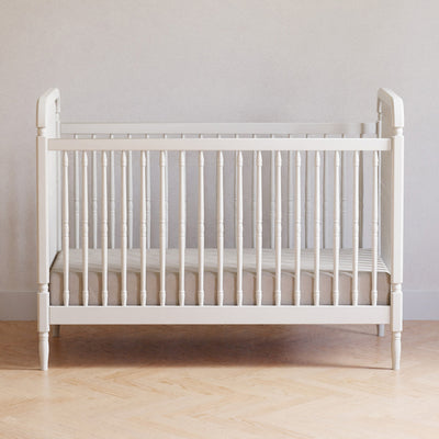 Lifestyle front view of The Namesake Liberty 3-in-1 Convertible Spindle Crib in -- Color_Warm White