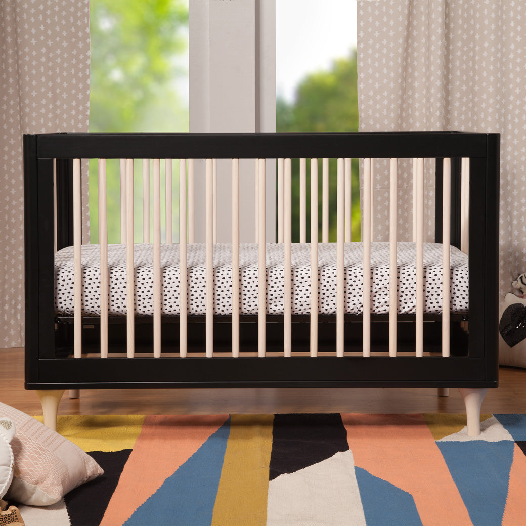 Front view in baby room of The Babyletto Lolly 3-in-1 Crib in -- Color_Black