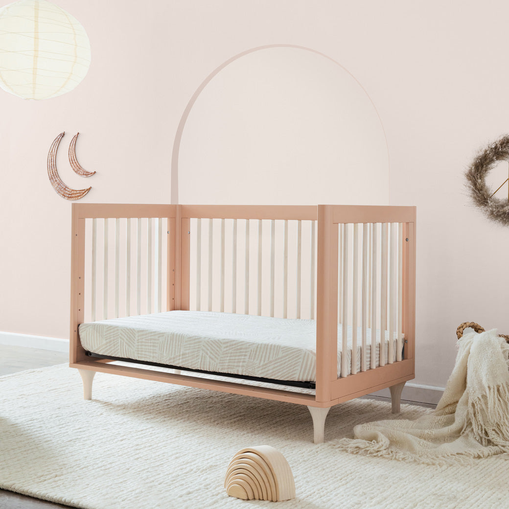 Day bed side view in a room with the Babyletto Lolly 3-in-1 Crib in Canyon