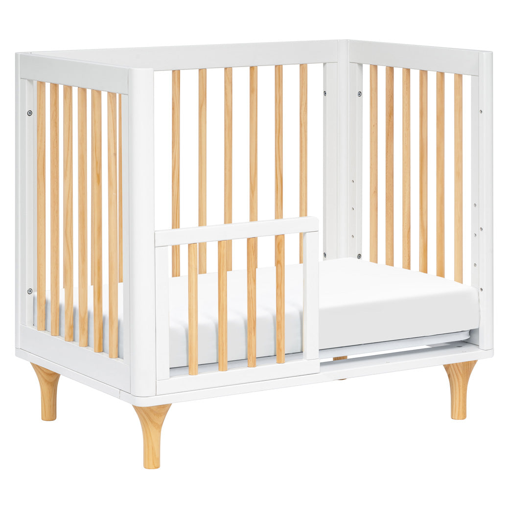 The Babyletto Lolly 4-in-1 Convertible Mini Crib as a toddler bed  in -- Color_White / Natural