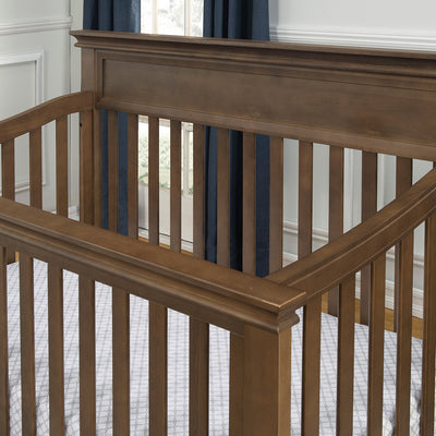 Closeup of rails of the Namesake's Foothill 4-in-1 Convertible Crib in -- Color_Mocha