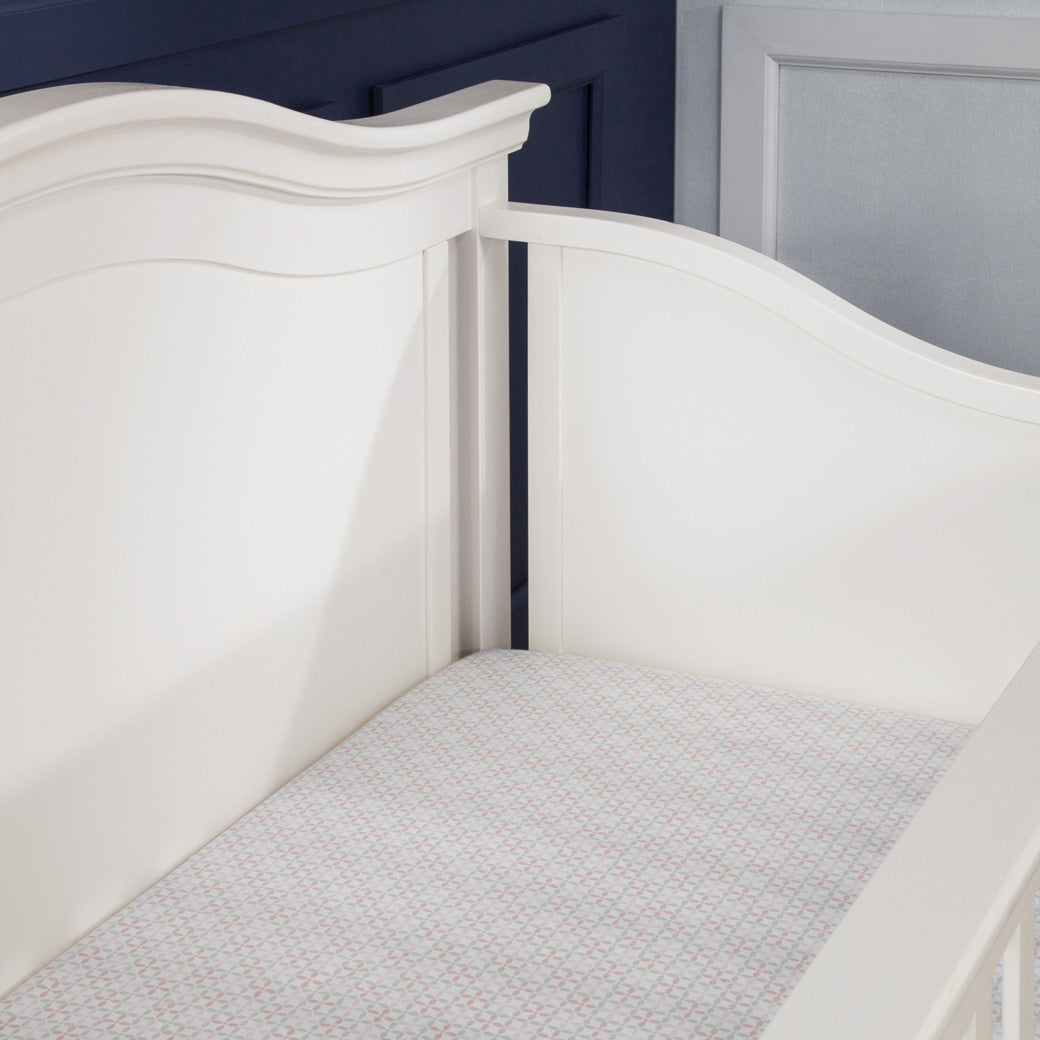Closeup of the inside of the Namesake's Louis 4-in-1 Convertible Crib in -- Color_Warm White