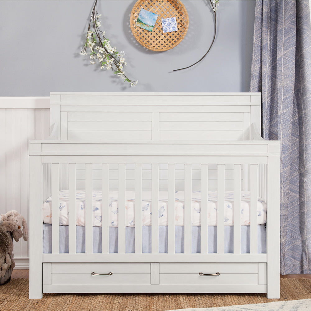 Front view of Namesake's Wesley Farmhouse Storage Crib in a kid's room in -- Color_Heirloom White