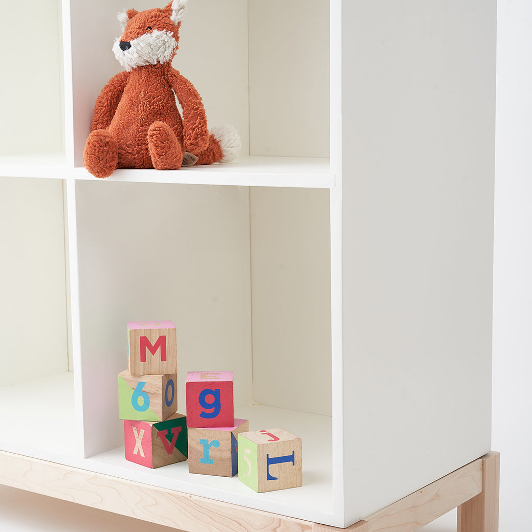 Closeup of Milton & Goose Cubby Bookshelf  with toys on it in -- Color_White