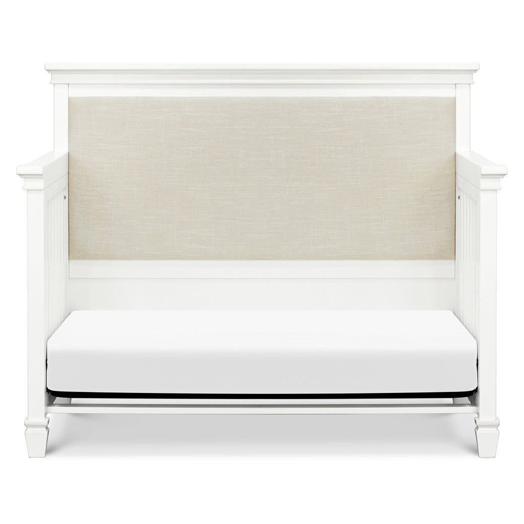 Front view of Darlington 4-in-1 Convertible Crib in Warm White as daybed