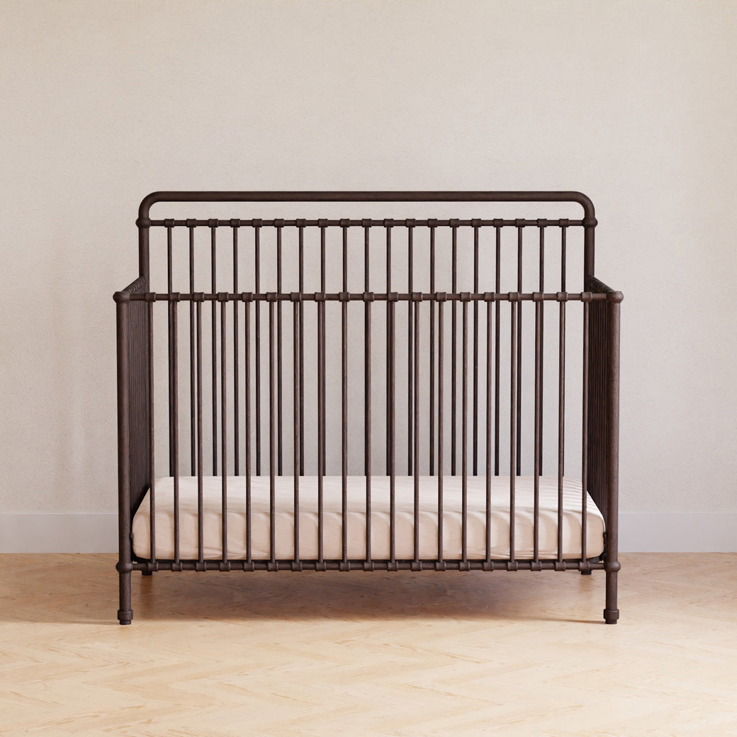 Front view of Namesake's Winston 4 in 1 Convertible Crib in a room in -- Color_Vintage Iron