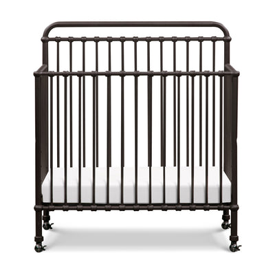 Front view of Namesake's Winston 4-in-1 Convertible Mini Crib in -- Color_Vintage Iron