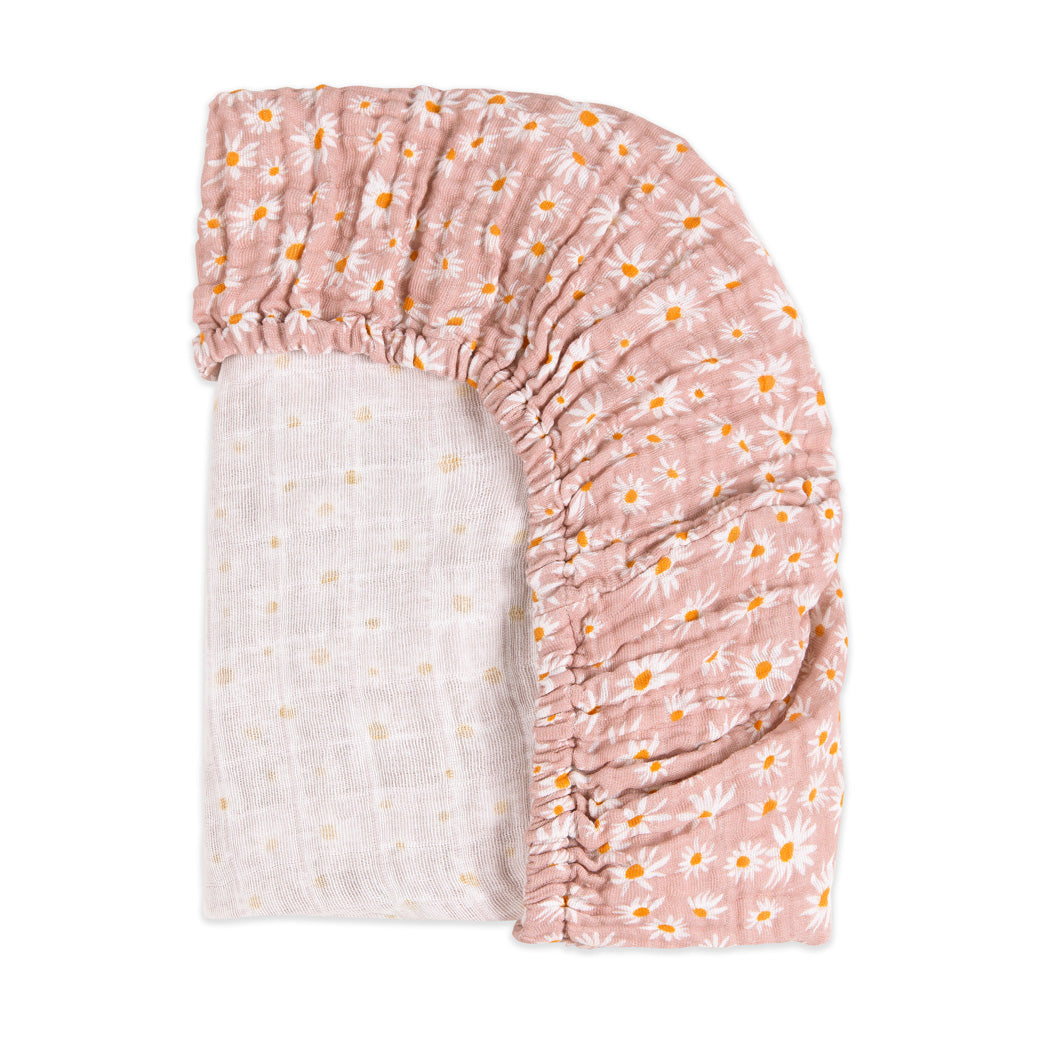 Back corner view of Babyletto's All-Stages Midi Crib Sheet In GOTS Certified Organic Muslin Cotton in -- Color_Daisy