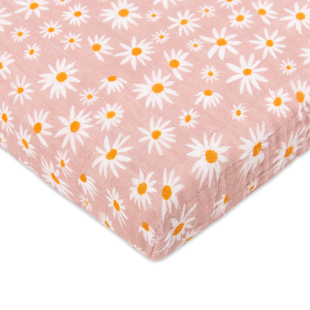 Corner view of Babyletto's All-Stages Midi Crib Sheet In GOTS Certified Organic Muslin Cotton in -- Color_Daisy