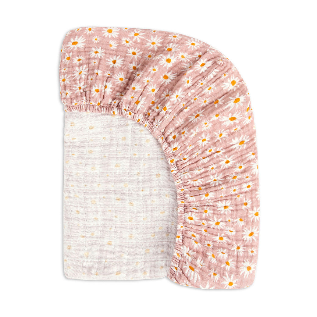 Back view of the corner of the Babyletto's Crib Sheet in GOTS Certified Organic Muslin Cotton in -- Color_Daisy