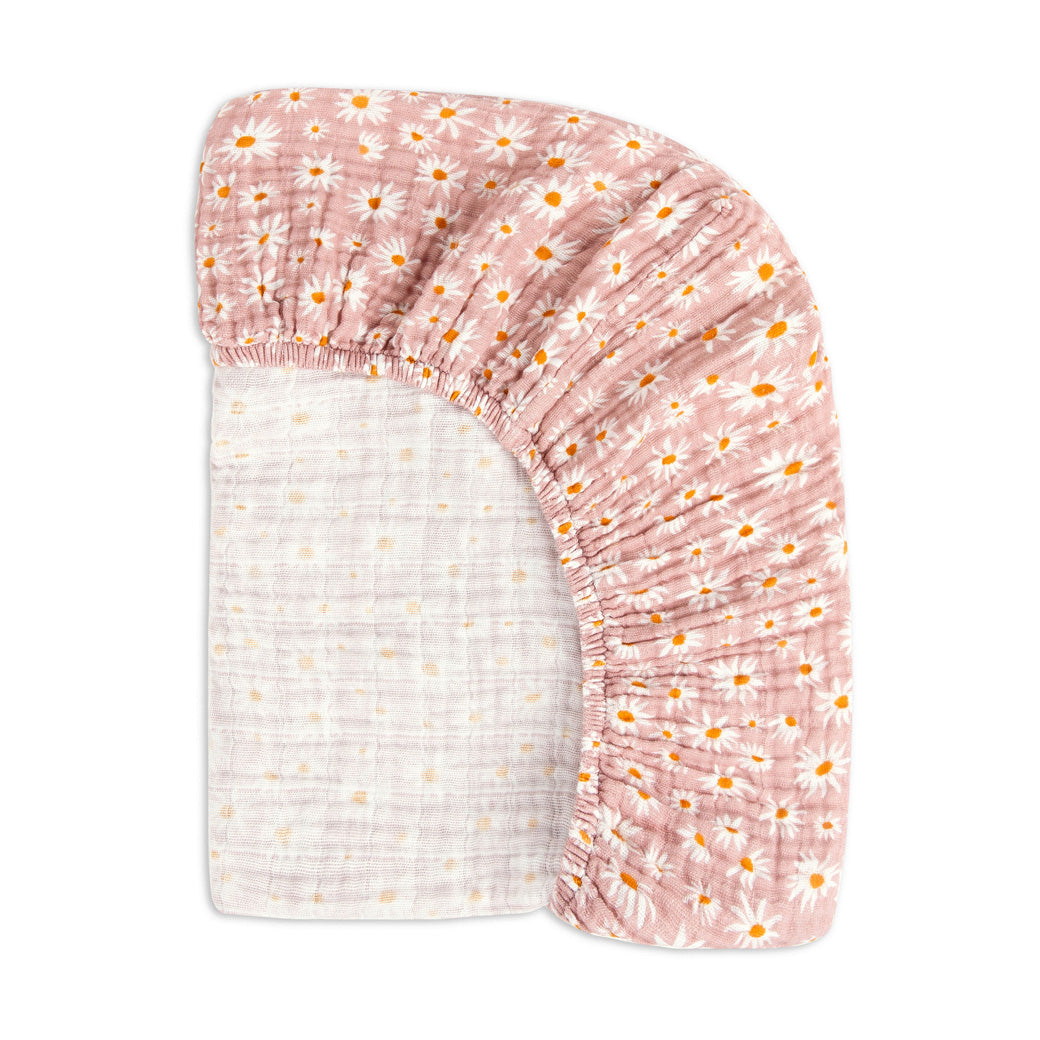 Back of the corner of the Babyletto's Mini Crib Sheet in -- Color_Daisy