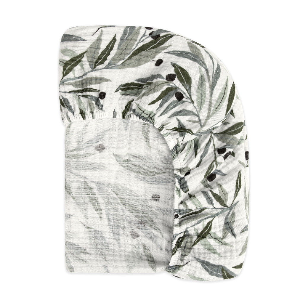 Back of the corner of the Babyletto's Mini Crib Sheet in -- Color_Olive Branches