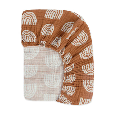 Back view of the corner of the Babyletto's Crib Sheet in GOTS Certified Organic Muslin Cotton in -- Color_Terracotta Rainbow