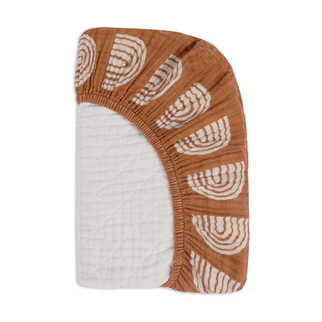 Folded corner of Babyletto Quilted Changing Pad Cover In GOTS Certified Organic Muslin Cotton in -- Color_Terracotta Rainbow