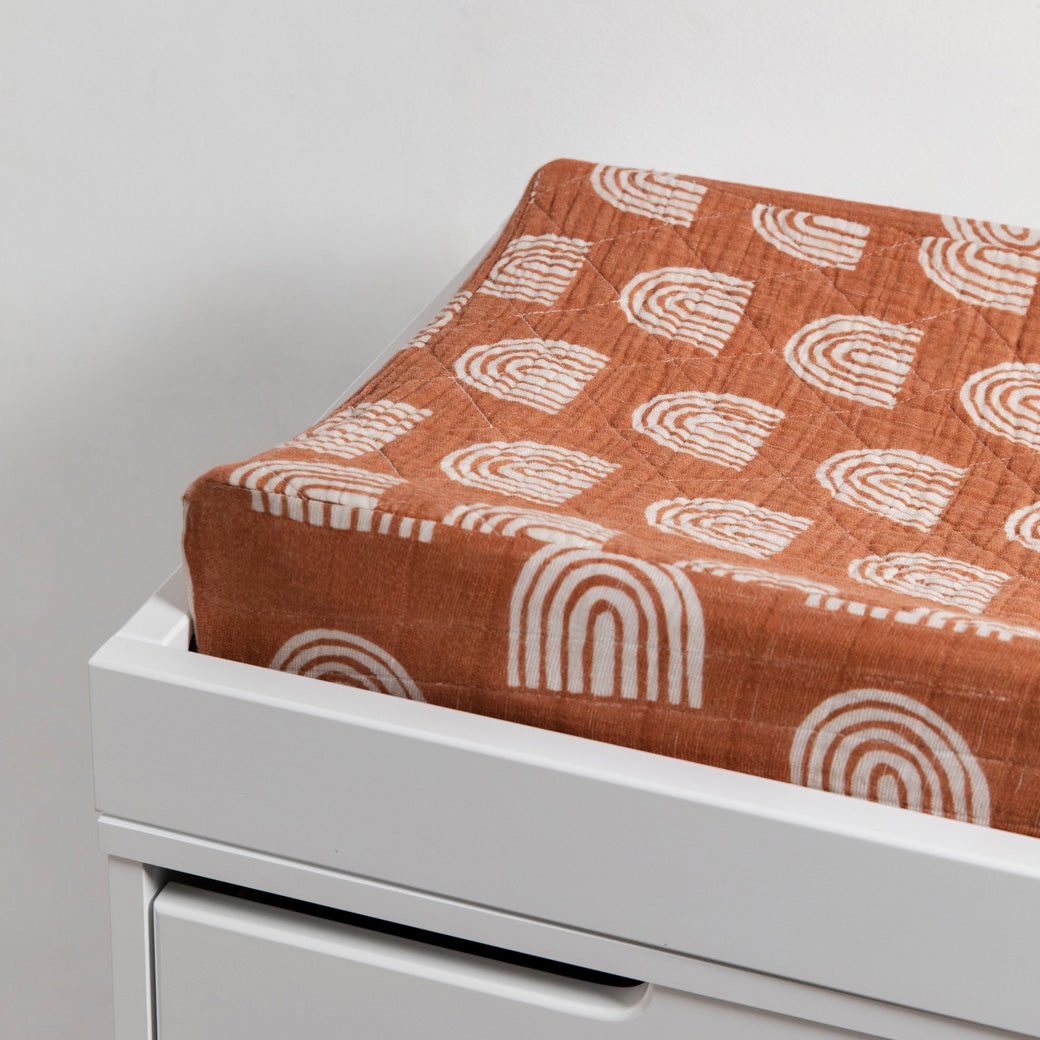 Babyletto Quilted Changing Pad Cover In GOTS Certified Organic Muslin Cotton in a changing tray in -- Color_Terracotta Rainbow