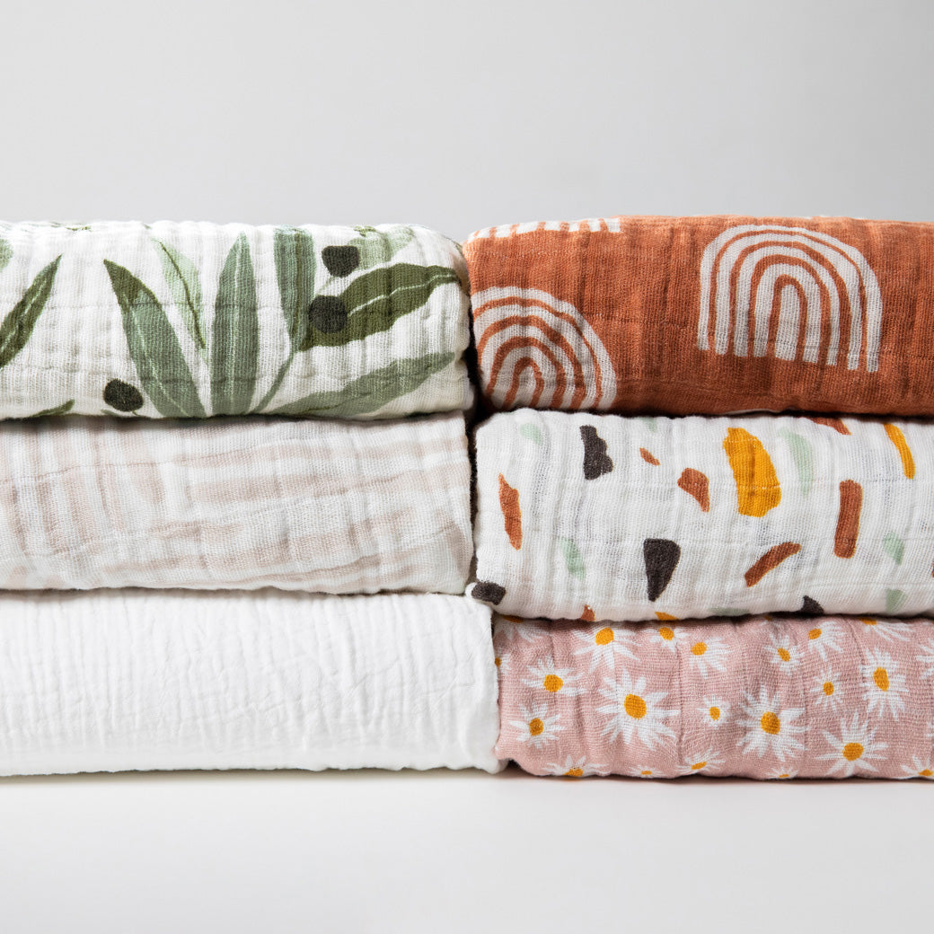 Six Babyletto's All-Stages Midi Crib Sheet In GOTS Certified Organic Muslin Cotton in -- Color_Olive Branches / Oat Stripe / White / Terracotta Rainbow / Terrazzo / Daisy