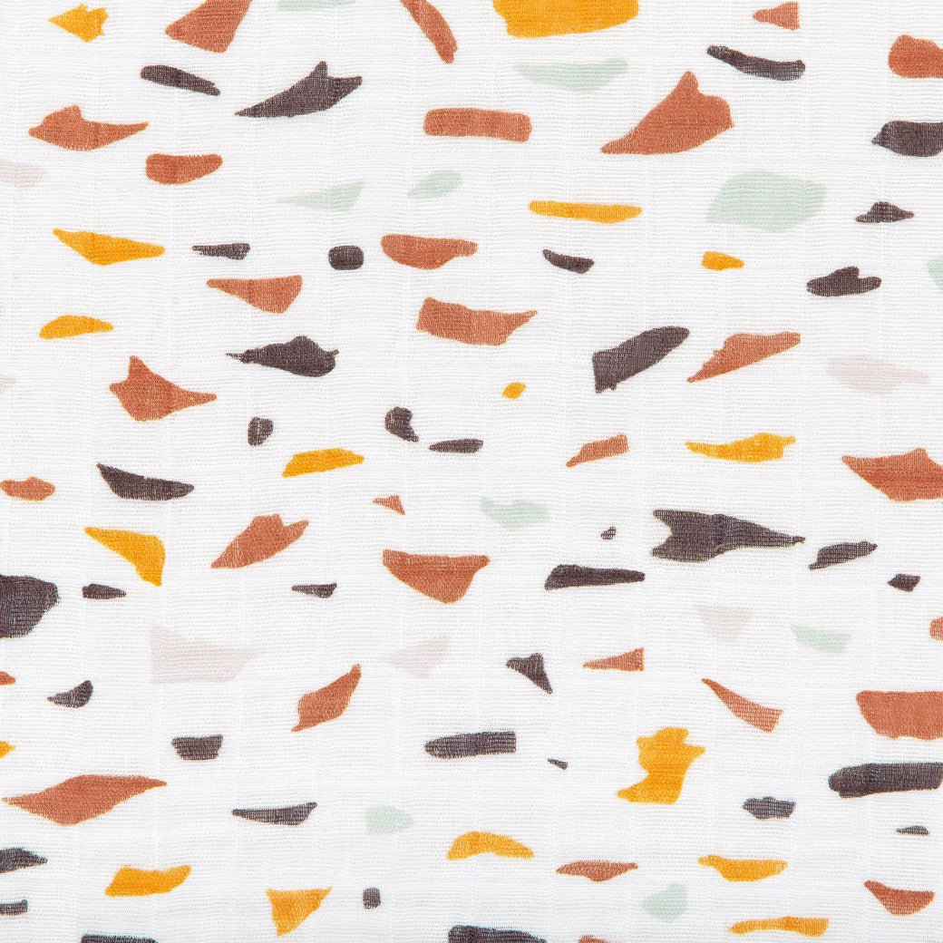 Closeup of pattern of Babyletto's All-Stages Midi Crib Sheet In GOTS Certified Organic Muslin Cotton in -- Color_Terrazzo