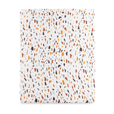 Front view of Babyletto's All-Stages Midi Crib Sheet In GOTS Certified Organic Muslin Cotton in -- Color_Terrazzo