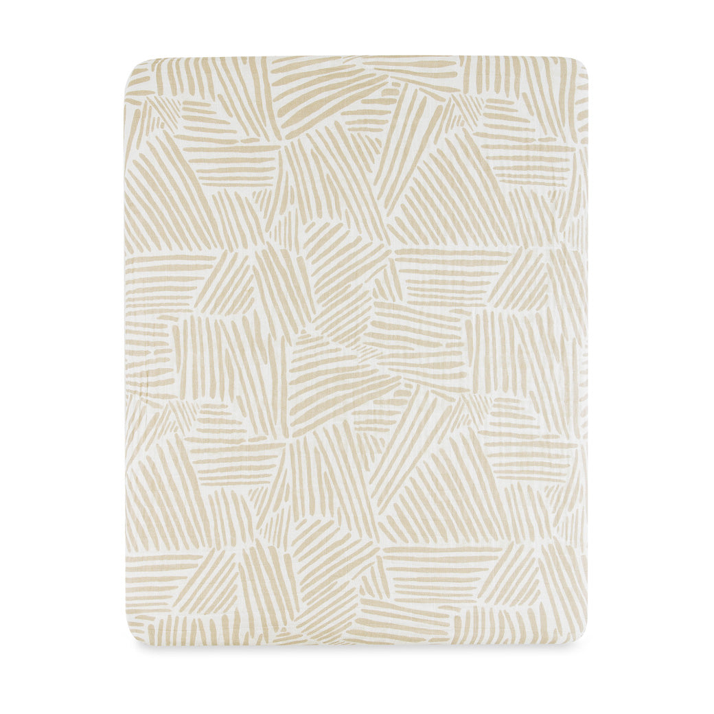 Front view of Babyletto's All-Stages Midi Crib Sheet In GOTS Certified Organic Muslin Cotton in -- Color_Oat Stripe