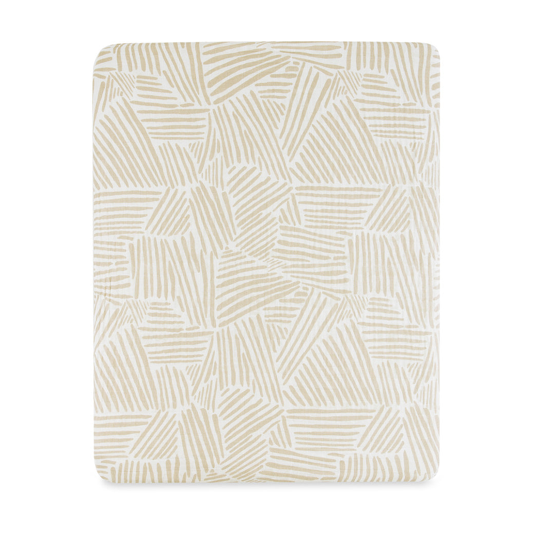 Front view of Babyletto's All-Stages Midi Crib Sheet In GOTS Certified Organic Muslin Cotton in -- Color_Oat Stripe