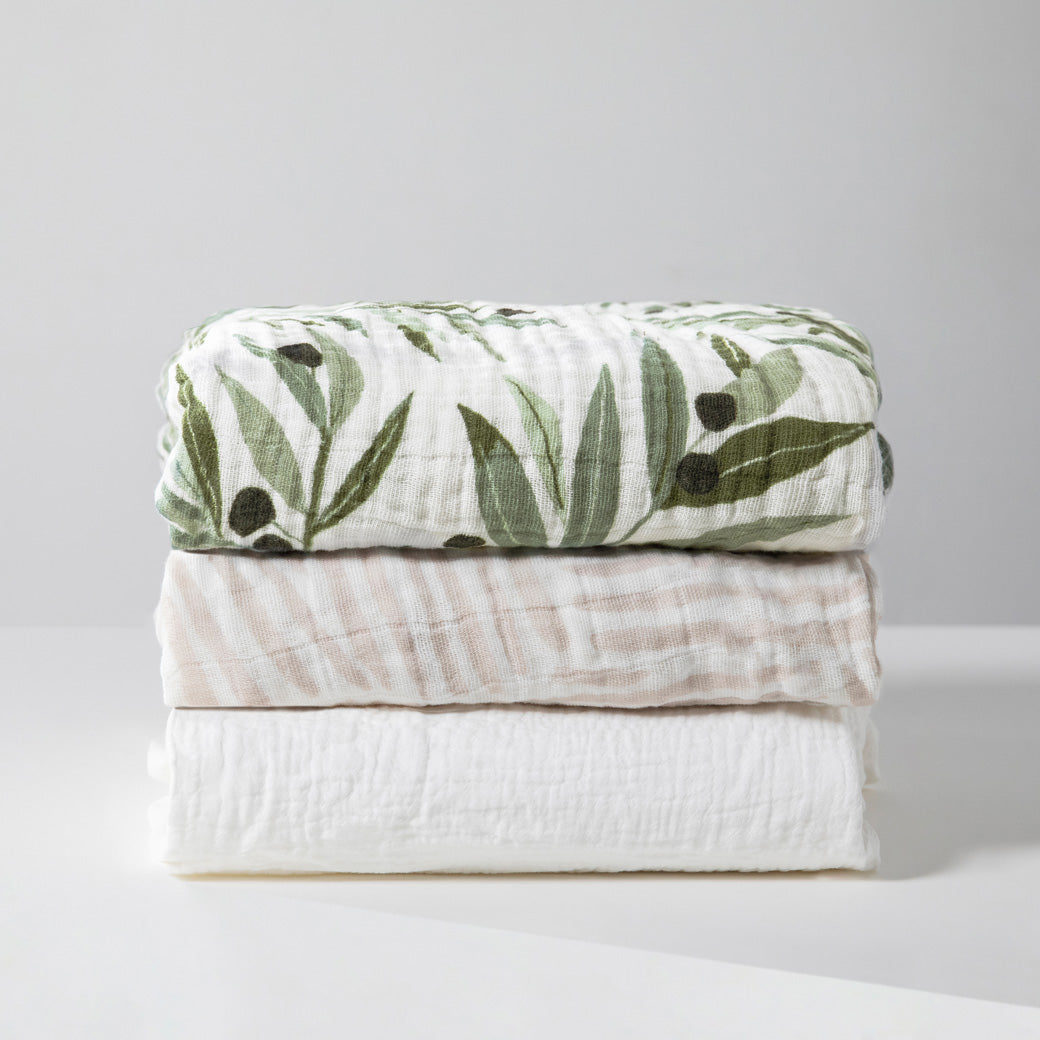 Three folded Babyletto's All-Stages Midi Crib Sheets In GOTS Certified Organic Muslin Cotton in -- Lifestyle