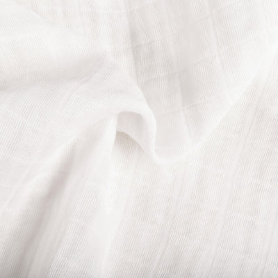 Ruffled closeup of material of Babyletto's All-Stages Midi Crib Sheet In GOTS Certified Organic Muslin Cotton in -- Color_White