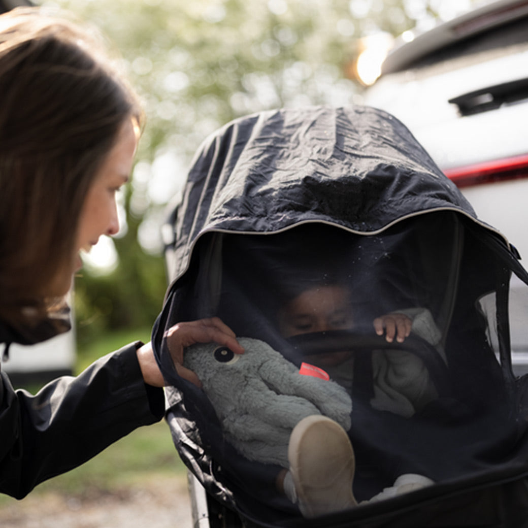 Mother and son with the Thule Shine All Weather Cover -- Lifestyle