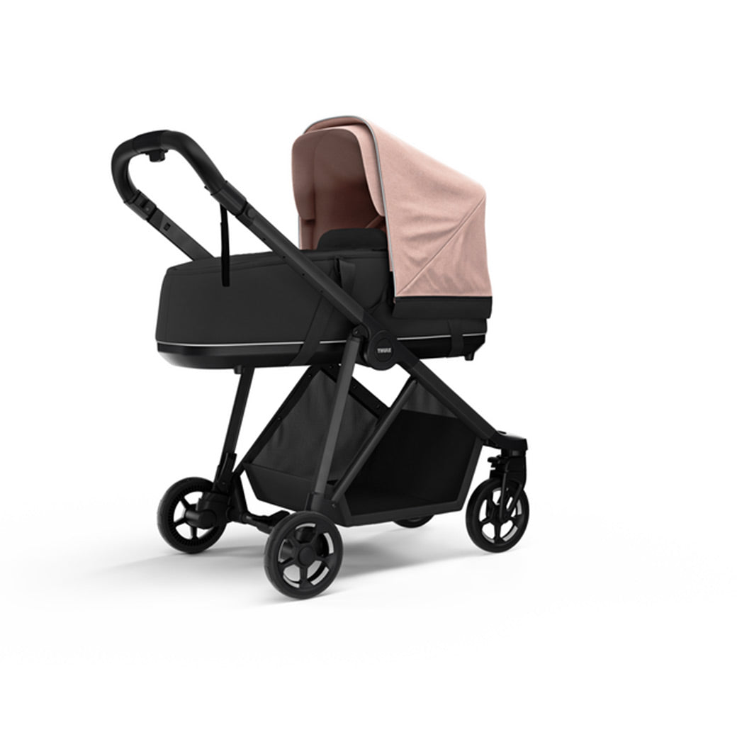 Side view of the Thule Shine Bassinet on the Thule Shine Stroller in Misty Rose
