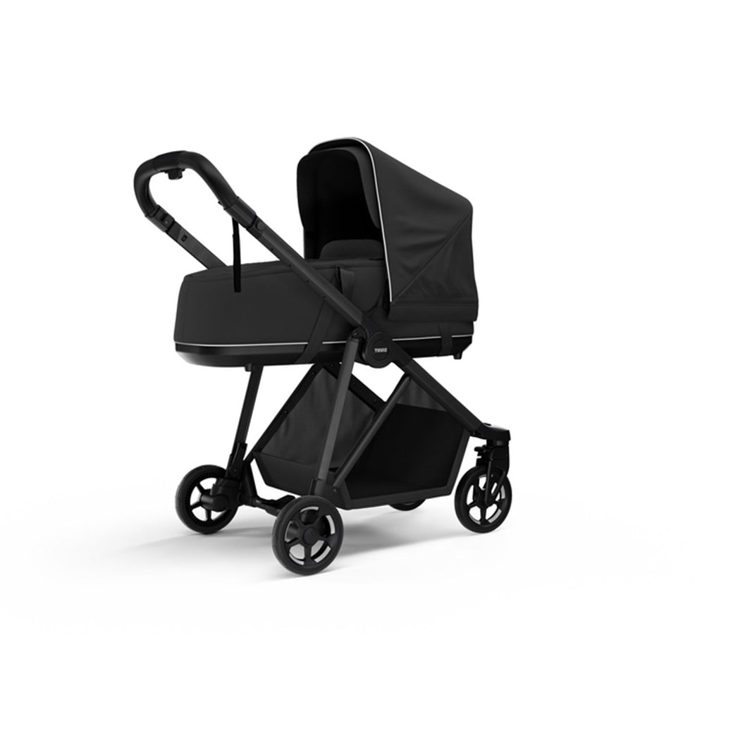 Side view of the Thule Shine Bassinet on the Thule Shine Stroller in Black