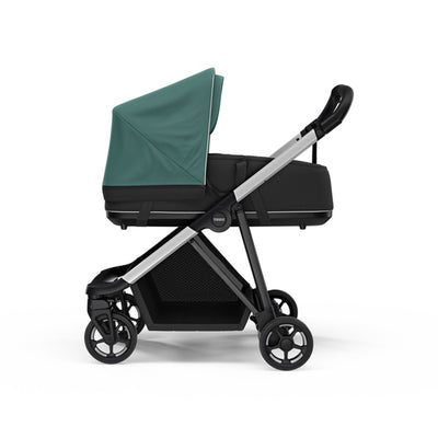 Side view of the Thule Shine Bassinet on the Thule Shine Stroller in -- Color_Mallard Green