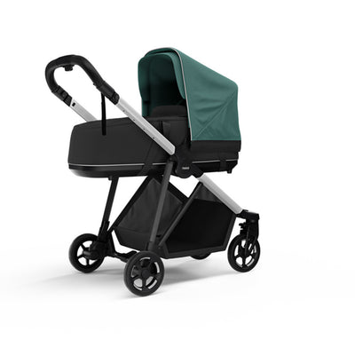 Side view of the Thule Shine Bassinet on the Thule Shine Stroller in Mallard Green