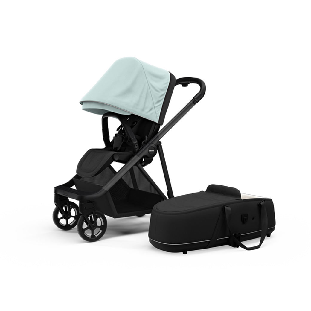 Side view of the Thule Shine Stroller in -- Color_Alaska with the Thule Shine bassinet