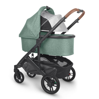 Angled view of reversed bassinet with sunshade down on UPPAbaby Cruz V2 Stroller in -- Color_Gwen