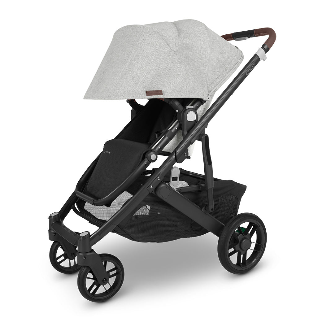 View of UPPAbaby CRUZ V2 Stroller with sunshade fully extended, angled slightly to the left with black frame and grey chenille fabric -- Color_Anthony