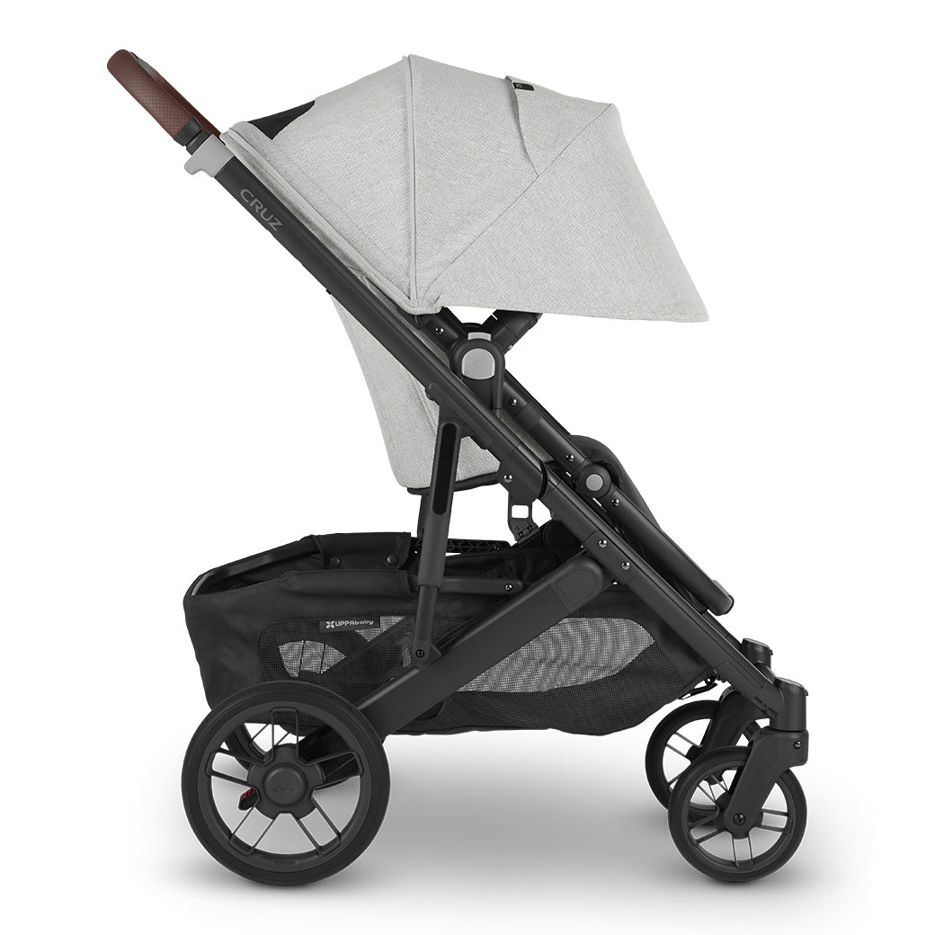 Side view of UPPAbaby CRUZ V2 Stroller with black frame and grey chenille fabric with sun shade fully extended -- Color_Anthony