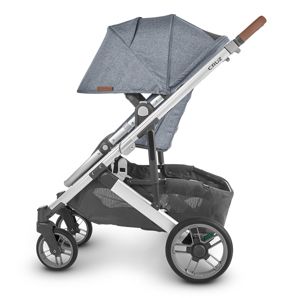Side view of the UPPAbaby CRUZ V2 Stroller with sun shade fully extended in bluish gray and black -- Color_Gregory