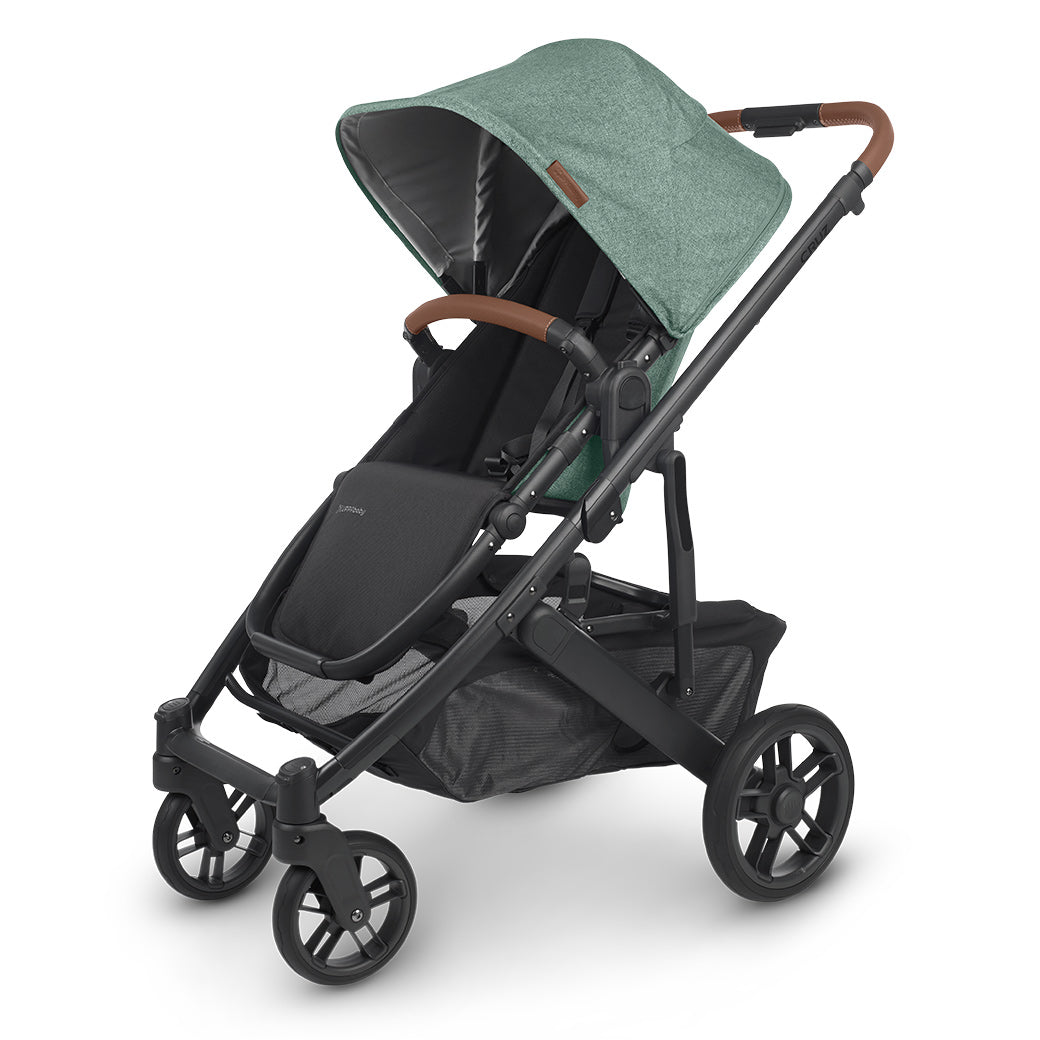 A three fourths view of UPPAbaby CRUZ V2 Stroller with black frame and matcha green fabric -- Color_Gwen