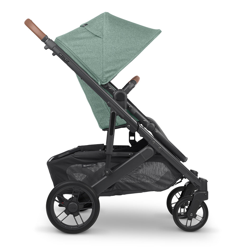 A side view of UPPAbaby CRUZ V2 Stroller with green shade -- Color_Gwen