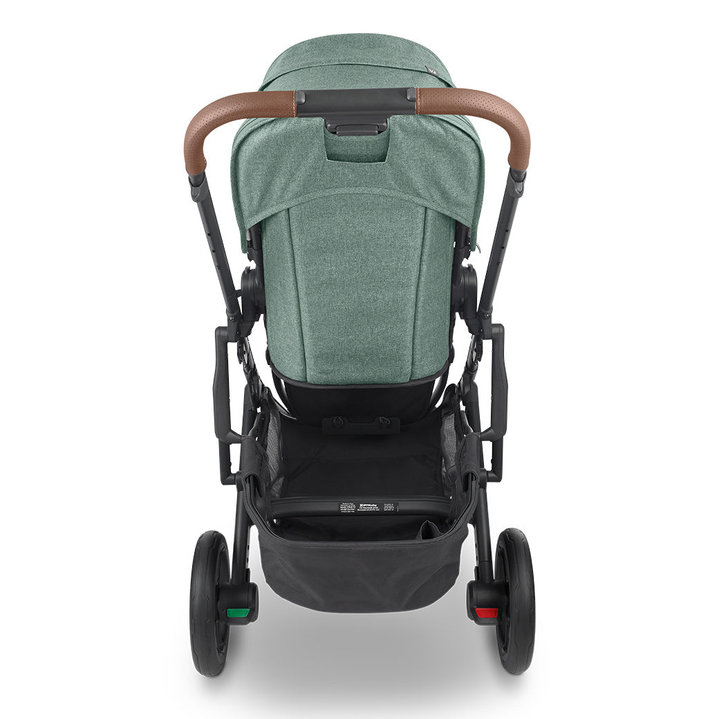 Back view of UPPAbaby CRUZ V2 Stroller in green and a black fabric basket on the bottom-- Color_Gwen