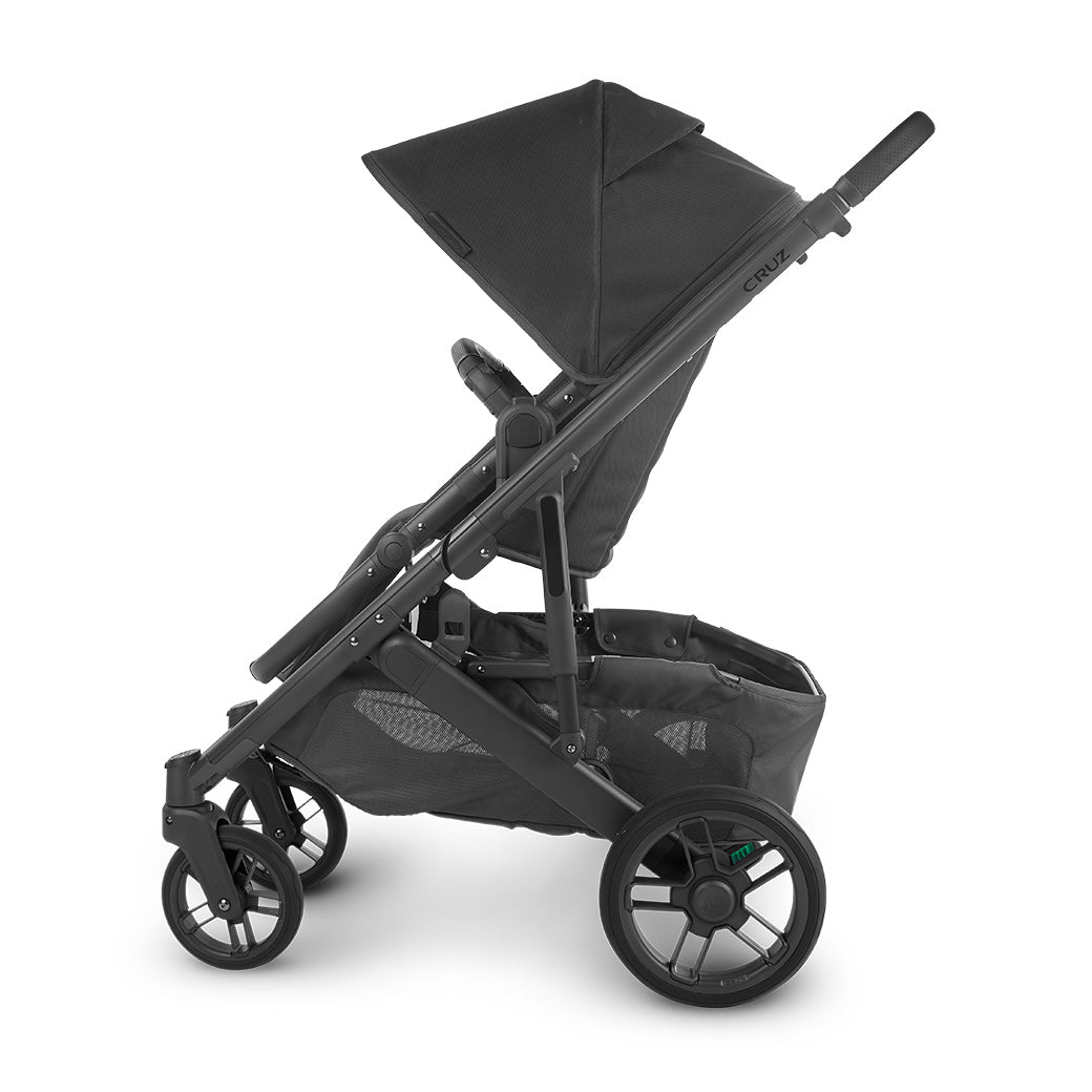 Side view of the UPPababy cruz v2 stroller front-facing with sunshade partially extended -- Color_Jake
